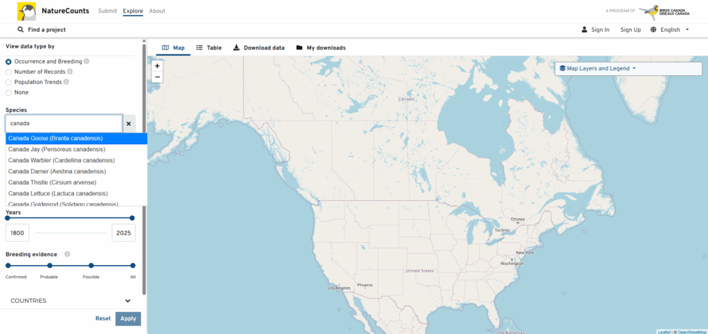 A screenshot of the NatureCounts website shows a blank map of North America on screen, beside which a user has typed 'Canada' into a search box. Several species with the word 'Canada' in their names have appeared in a dropdown.